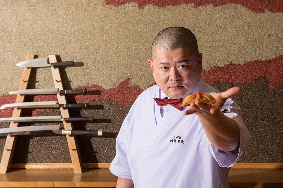 調理をしている料理人